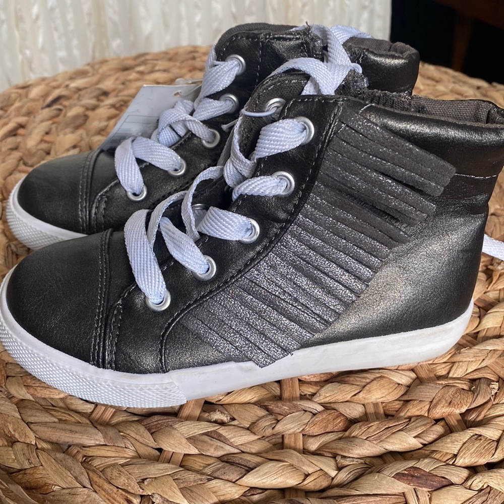Brand new with tag, adorable metallic sneaker with fringe
